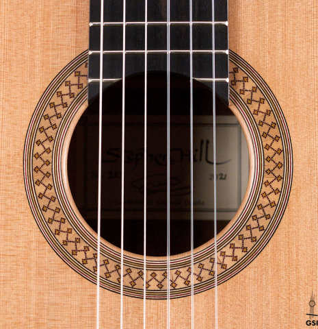The rosette of a 2021 Stephen Hill classical guitar made with cedar and exotic ebony