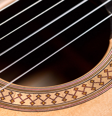 The rosette of a 2021 Stephen Hill classical guitar made with cedar and exotic ebony