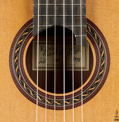 The rosette of a 2025 Kenny Hill "Signature CD/SP" classical guitar made of a cedar/spruce double top and Indian rosewood