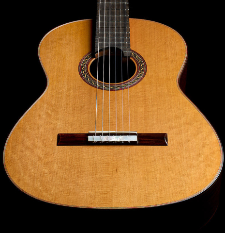 The soundboard of a 2025 Kenny Hill "Signature CD/SP" classical guitar made of a cedar/spruce double top and Indian rosewood