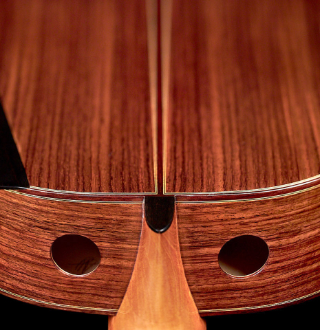 These are two soundports and enhanced ergonomics of a 2022 Kenny Hill “Signature Legacy 640 CD/SP” CD/IN classical guitar. 