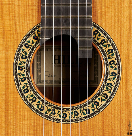 The rosette of a 2020 Kenny Hill "Heritage" classical guitar made of cedar and Indian rosewood