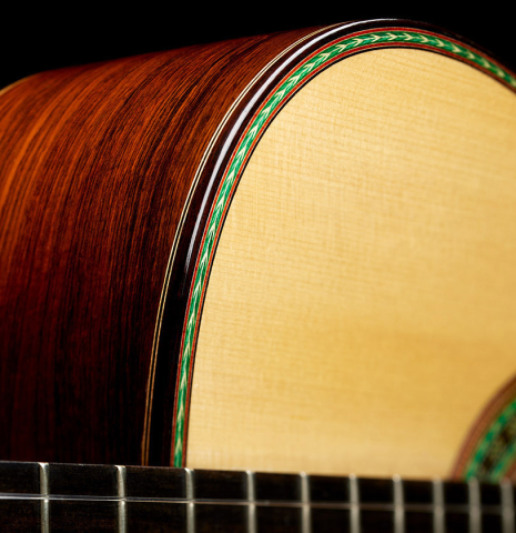 The top, side, binding and purflings of a 2021 Kenny Hill "Torres 640" classical guitar made of spruce and CSA rosewood