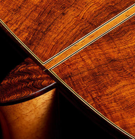 The heel, back binding and purfling of a 2021 Kenny Hill "Torres 640" classical guitar made of spruce and CSA rosewood