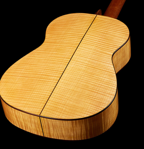 The sides and back of a 2015 Kenny Hill "Performance 640 SP/CD" classical guitar made of spruce and maple