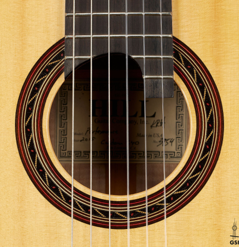 The rosette of a 2015 Kenny Hill "Performance 640 SP/CD" classical guitar made of spruce and maple
