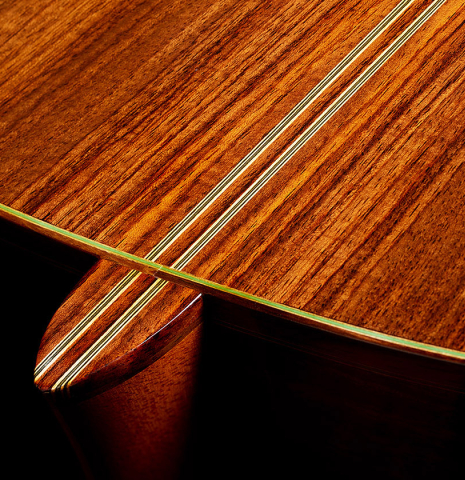 The heel, back binding and purflings of a 2008 Kenny Hill "1937 Hauser" classical guitar made of spruce and Indian rosewood