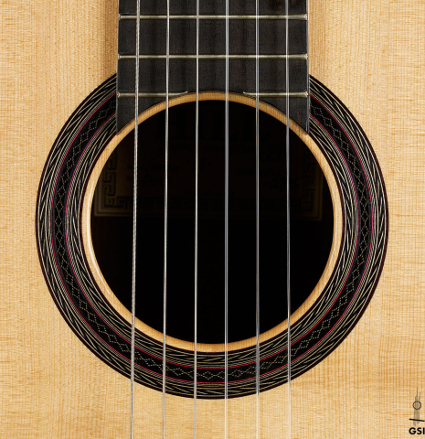 The rosette of a 2008 Kenny Hill "1937 Hauser" classical guitar made of spruce and Indian rosewood