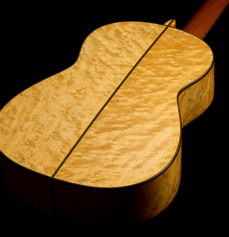 The back and sides of a 2009 Kenny Hill "Torres 640 Lattice Double Top" classical guitar made of spruce and maple