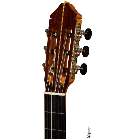 The headstock of a 2009 Kenny Hill "Torres 640 Lattice Double Top" classical guitar made of spruce and maple
