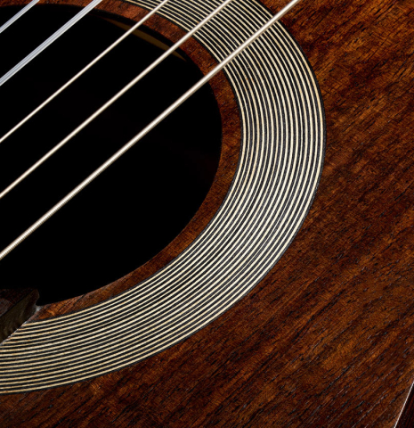 The soundboard and rosette of a 2025 Kenny Hill "Companion" classical guitar made of Indian rosewood for the top, back and sides