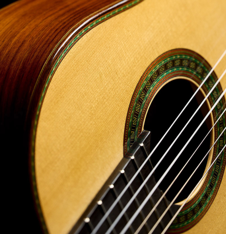 The top, side and rosette of a 2025 Kenny Hill "Torres 640" classical guitar made of spruce and CSA rosewood