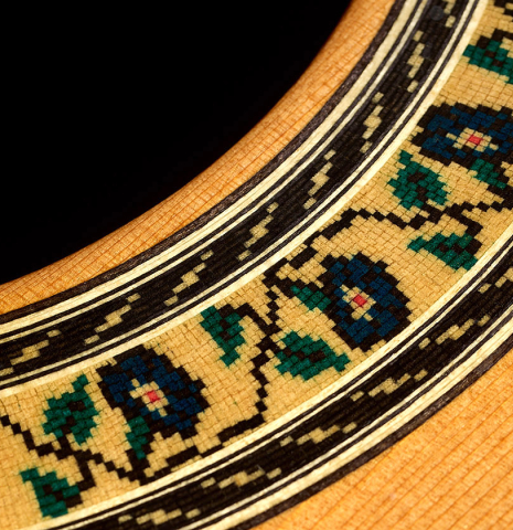 Detailed closeup of the rosette of a 2020 Kenny Hill "Special CD/SP" made of cedar/spruce and Indian rosewood