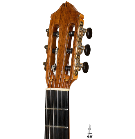 The headstock of a 2010 Kenny Hill "Signature CD/SP" classical guitar with electronics made of cedar/spruce and Indian rosewood