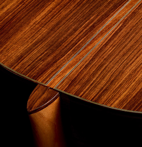 The heel, back binding and purfling of a 2020 Kenny Hill "Heritage" classical guitar made of spruce and Indian rosewood