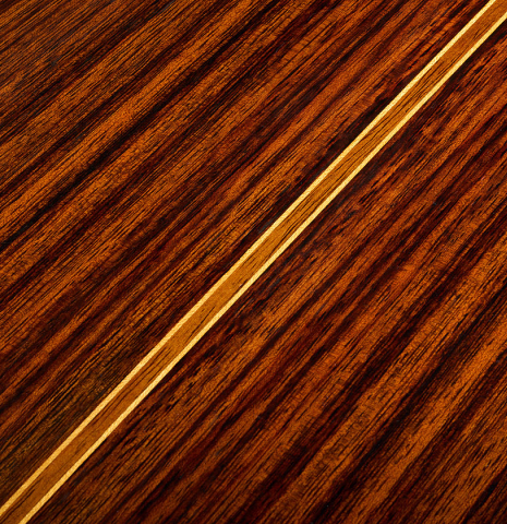 The back center seam of a 2009 Dieter Hopf “Super Classic” classical guitar made of cedar and Indian rosewood