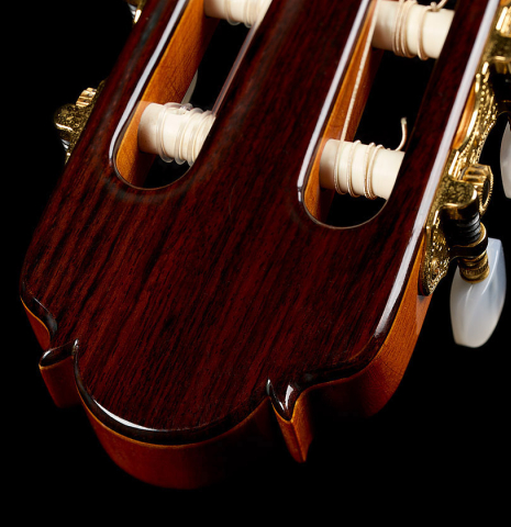 The headstock and tuning machines of a 2009 Dieter Hopf “Super Classic” classical guitar made of cedar and Indian rosewood