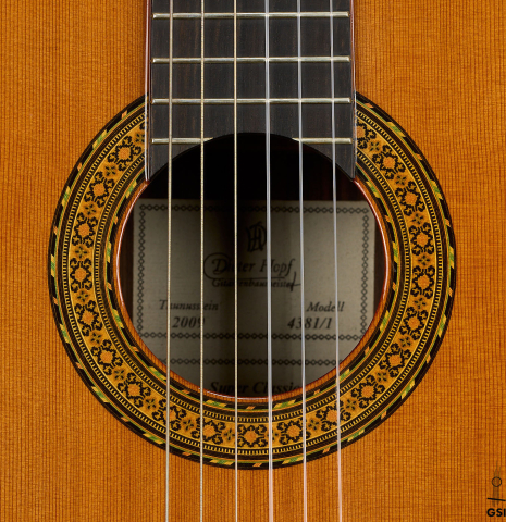 The rosette of a 2009 Dieter Hopf “Super Classic” classical guitar made of cedar and Indian rosewood