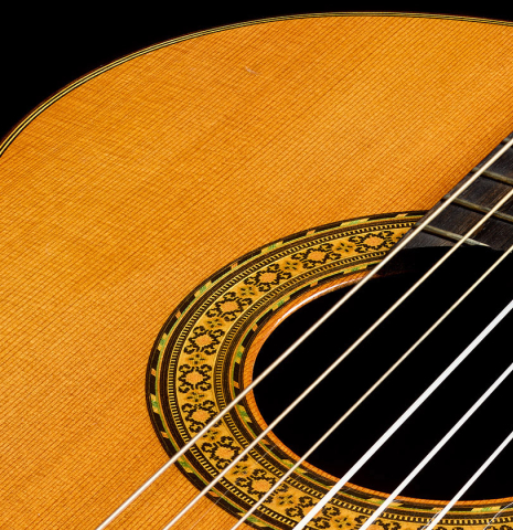 The soundboard and rosette of a 2009 Dieter Hopf “Super Classic” classical guitar made of cedar and Indian rosewood