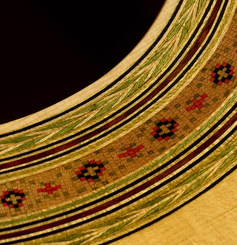 Closeup detail of the rosette of a 2017 Richard Howell classical guitar made of spruce and maple