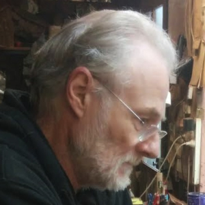 Richard Howell at his workbench in his guitar workshop