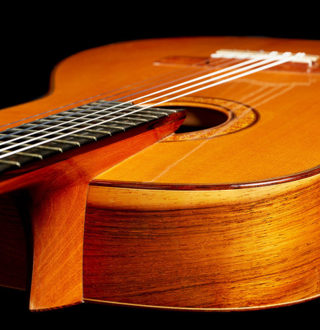 The elevated fingerboard of a 1993 Thomas Humphrey "Millennium" classical guitar made with spruce and CSA rosewood.