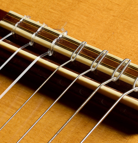 The bridge, tie-block and saddle of a 1988 Thomas Humphrey "Millennium 7-string" classical guitar made of spruce and CSA rosewood (ex John Dearman)