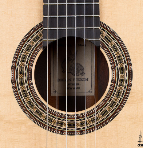The rosette of a 2025 Brian Itzkin classical guitar made of spruce and Indian rosewood