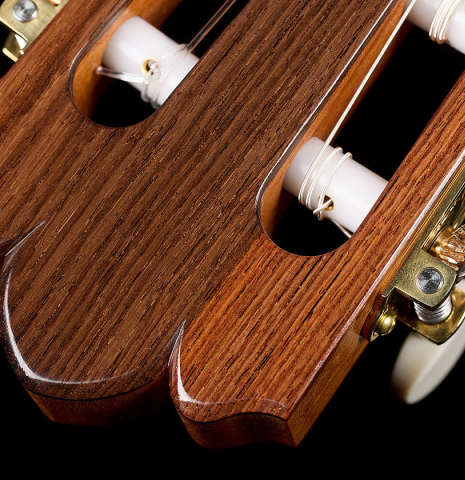 The three-lobed headstock shape and tuning machines of a 2026 Brian Itzkin "635" classical guitar made of spruce and African rosewood