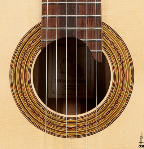 The rosette of a 2026 Brian Itzkin "635" classical guitar made of spruce and African rosewood