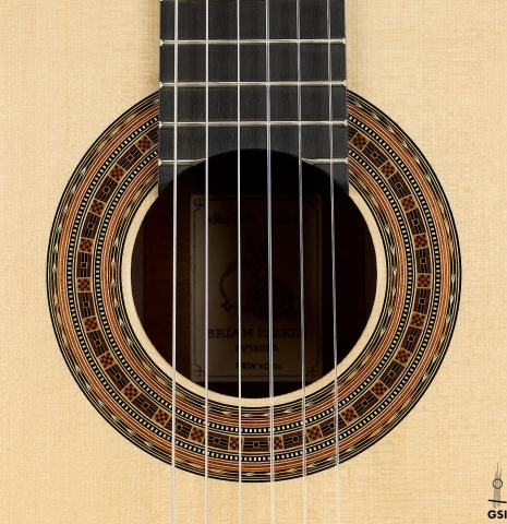 The rosette of a 2026 Brian Itzkin classical guitar made of spruce and African rosewood