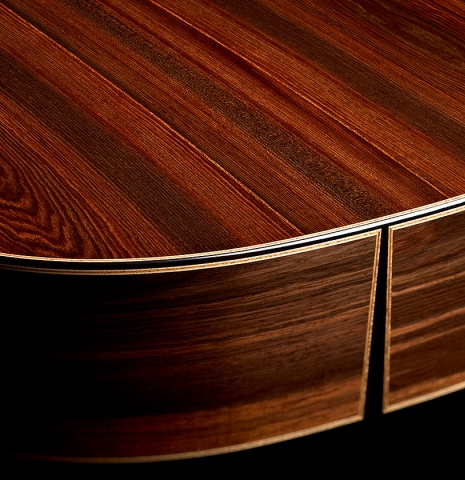 The back and sides at the foot of a 2026 Brian Itzkin classical guitar made of spruce and African rosewood