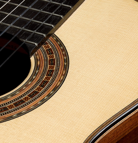 The soundboard and rosette detail of a 2026 Brian Itzkin classical guitar made of spruce and African rosewood
