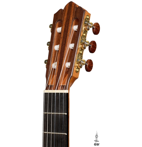 The headstock of a 2026 Brian Itzkin classical guitar made of spruce and African rosewood