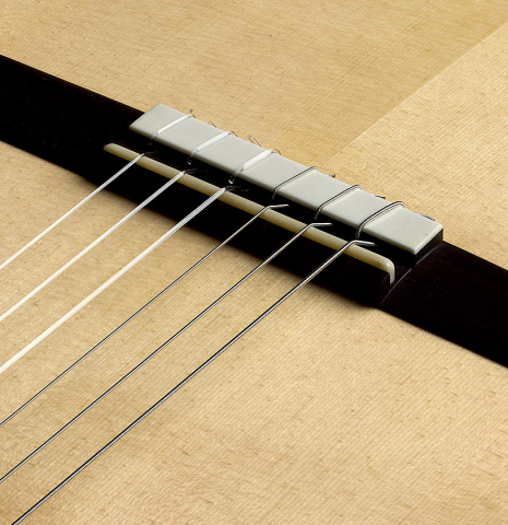The bridge, tie-block and saddle of a 2026 Brian Itzkin classical guitar made of spruce and CSA rosewood