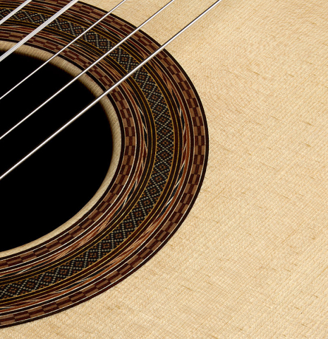 The top and rosette of a 2026 Brian Itzkin classical guitar made of spruce and CSA rosewood
