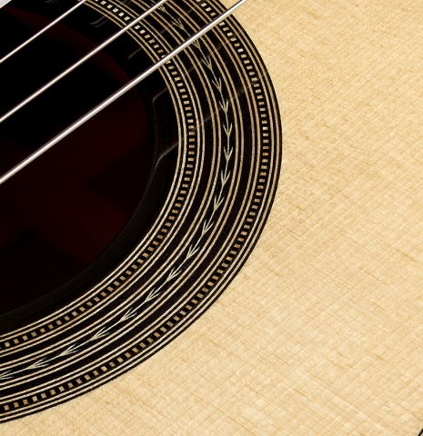 The soundboard and rosette detail of a 2026 Brian Itzkin "635" classical guitar made of spruce and CSA rosewood
