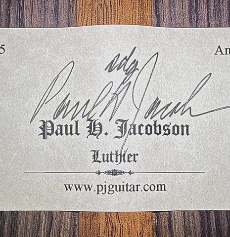 The label of a 2002 Paul Jacobson classical guitar made of cedar and Indian rosewood