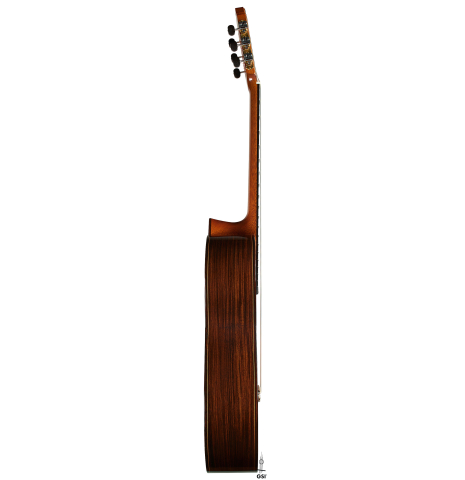 The side of a 2002 Paul Jacobson classical guitar made of cedar and Indian rosewood