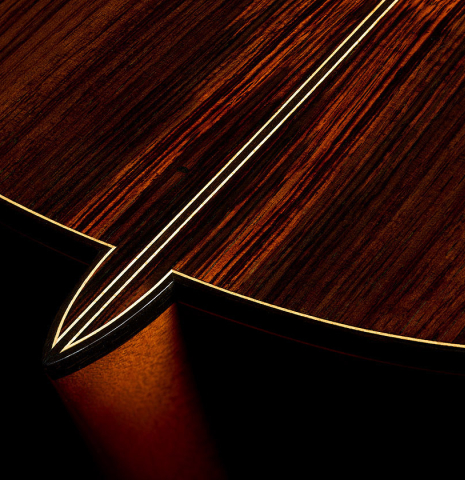 The heel, back binding and purfling of a 1997 Paul Jacobson classical guitar made of cedar and CSA rosewood