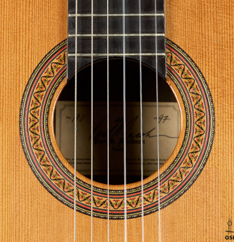The rosette of a 1997 Paul Jacobson classical guitar made of cedar and CSA rosewood