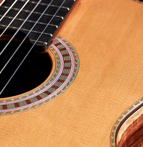 The soundboard of a 2024 Wolfgang Jellinghaus "Signature CD/CD" classical guitar made of cedar and Granadillo