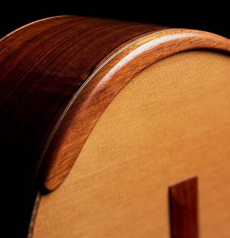 The armrest of a 2025 Wolfgang Jellinghaus "Signature CD/CD" classical guitar made of cedar and Granadillo