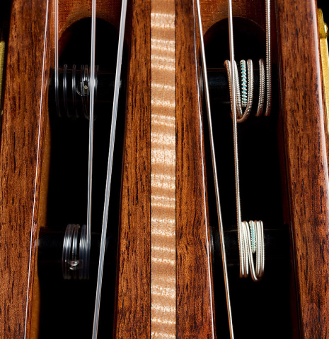 The headstock inlay and tuning machines of a 2025 Wolfgang Jellinghaus "Signature CD/CD" classical guitar made of cedar and granadillo