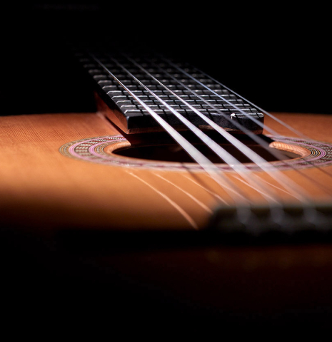 The floating fingerboard of a 2023 Wolfgang Jellinghaus "Signature CD/CD" CD/ZR classical guitar.