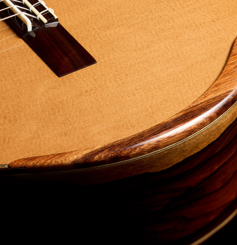 The arm rest on the top of a 2025 Wolfgang Jellinghaus "Signature CD/CD" classical guitar made of cedar and ziricote