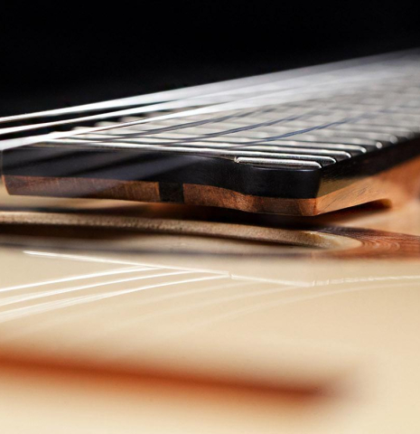 The floating fingerboard of a 2021 Wolfgang Jellinghaus "Signature SP/CD 640" SP/GR classical guitar.