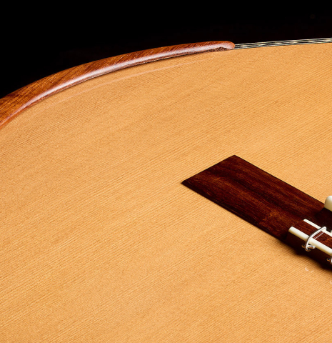 The armrest, bridge and top of a 2026 Wolfgang Jellinghaus "Signature CD/SP" classical guitar made of cedar/spruce and granadillo