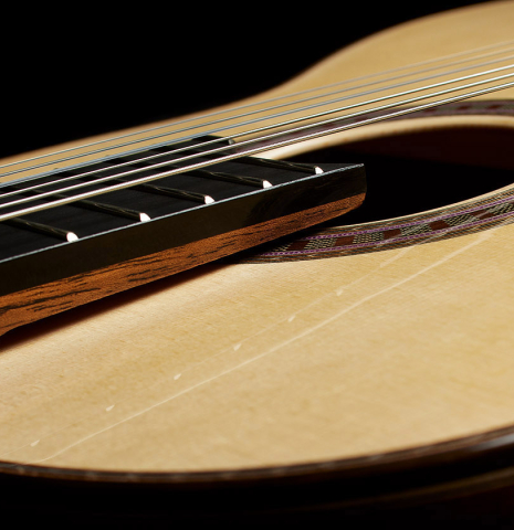 The soundboard and raised fingerboard of a 2025 Wolfgang Jellinghaus "Signature SP/SP" classical guitar made of spruce and granadillo
