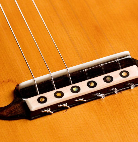 The bridge, tie-block and saddle of a Wolfgang Jellinghaus "La Romantica 1a" made of spruce and maple